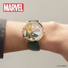 a person wearing a watch on their wrist with the word marvel in front of them