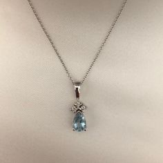 Gorgeous Aqua Marine And Diamond Pendant On Dainty Silver Chain. Chain Is 18” In Length. I Received This As A Gift Many Years Ago And Never Wore It. Will Send It In The Black Case It Came In. The Case Is Not In Great Shape. Was Purchased At Macy’s. Reasonable Offers Will Be Considered. Fine Jewelry Pendant Necklace With Silver Chain, Fine Jewelry Silver Chain Pendant Necklace, Fine Jewelry Silver Pendant Necklace, Classic Teardrop Silver Diamond Necklace, Silver Drop Necklaces With Diamond Accents, Silver Drop Necklace Fine Jewelry, Elegant Teardrop Pendant Drop Necklace With Chain, Silver Drop Necklaces Fine Jewelry, Formal Silver Drop Necklace With Adjustable Chain