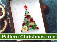 an image of a christmas tree made out of rolled up paper and button circles in a frame