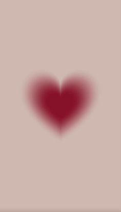 a red heart on a light pink background