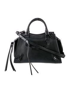 Balenciaga Top Handle BagFrom the Fall/Winter 2020 Collection by Demna GvasaliaBlack LeatherTonal HardwareRolled Handles & Single Shoulder StrapSingle Exterior PocketLeather Lining & Single Interior PocketZip Closure at TopIncludes Dust BagUnfortunately, due to restrictions, this item may not be eligible for shipping in all areas. Designer Black Bags For Winter, Designer Black Bag For Fall, Black Satchel For Fall, Black Bags With Branded Hardware For Fall, Black Shoulder Bag With Branded Hardware For Fall, Fall Shoulder Bag With Branded Hardware In Black, Fall Black Bags With Branded Hardware, Balenciaga Top, Balenciaga Leather