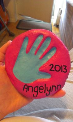 a handprinted rock with the name angelynn on it