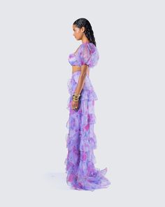 The princess is here 👑 With a look that will have everyone bowing down to you, this two-piece set features a purple floral cropped top paired with a matching organza maxi skirt 💜 Feminine Ruffled Sets For Parties, Floor-length Floral Print Organza Set, Purple Flowy Party Dress, Purple Party Maxi Skirt, Purple Flowy Maxi Skirt For Party, Flowy Purple Maxi Skirt For Party, Purple Tiered Skirt Party Dresses, Spring Party Sets With Flowy Skirt, Evening Organza Sets With Ruffles