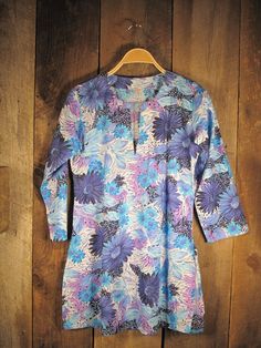 Tunic Lavender Flowers – Girl Intuitive Blue V-neck Tunic For Spring, Blue Cotton V-neck Tunic, Floral Print V-neck Summer Tunic, Fitted Floral Print Tunic, Blue Floral Print Beach Tunic, Blue Floral Print Tunic For The Beach, Casual Blue Floral Print Tunic, Fitted Cotton V-neck Tunic, Blue Floral Print Long Sleeve Tunic