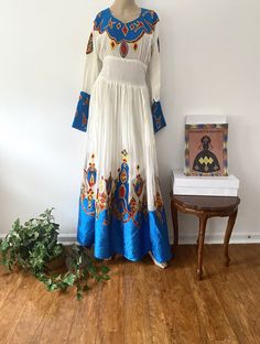 -Custom-made Ethiopian & Eritrean Dress. -This order takes approximately 4-5 weeks to make and deliver. -We will contact you about measurements instructions upon purchase. -You are allowed to change the colors and design. - Ethiopian dress - Eritrean dress - Habesha Kemis - Ethiopian Wedding - Eritrean Wedding - Habesha wedding - Zuria - Eritrean Traditional Dress -Ethiopian Traditional Dress -Ethiopian kids clothing -Eritrean kids clothing -Ethiopian men clothing -Eritrean men clothing Ethiopian Men, Eritrean Wedding, Habesha Wedding, Eritrean Dress, Ethiopian Wedding, Ethiopian Traditional Dress, Ethiopian Dress, Habesha Kemis, Gold Headpiece