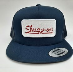 Brand new high-quality embroidered patch on a flat bill mesh trucker snapback cap hat blue Blue Trucker Hat With Embroidered Logo, Blue Trucker Hat With Logo Patch And Flat Bill, Blue Trucker Snapback Hat With Logo Patch, Blue Snapback Hat With Logo Patch, Blue Snapback Baseball Cap With Embroidered Patch, Blue Snapback Hat With Embroidered Patch, Blue Trucker Hat With Embroidered Patch, Blue Embroidered Snapback Baseball Cap, Blue Snapback Trucker Hat With Embroidered Patch