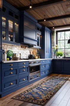 a kitchen with blue cabinets and wood flooring is pictured in this image from the front view