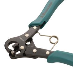 a pair of scissors with green handles on a white background