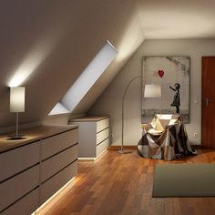 an attic bedroom with wood flooring and white walls, along with wooden dressers