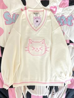 This sweater features a charming V-neck design adorned with delightful kitty patterns, making it irresistibly cute. The fabric is incredibly soft and cozy, ensuring a comfortable wear.  Please note that the price includes only the sweater.   	 		 			Size 			S 			M 			L 		 		 			Length 			62 			68 			72 		 		 			Bust 			120 			124 			128 		 		 			Sleeve Length 			49 			50 			51 Kawaii Sweater Dress, Cute Sweaters Aesthetic, Cozy Clothes Aesthetic, Kirby Sweater, Pokemon Sweater, Kawaii Things To Buy, Hello Kitty Clothing, Cute Kawaii Clothes, Cute Kawaii Outfits