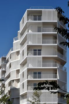 an apartment building with balconies on the side