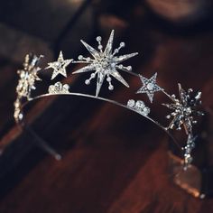 a tiara with snowflakes on it sitting on a table