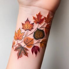 a woman's arm with leaves painted on the side of her body and it is showing