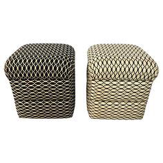 two black and white baskets sitting next to each other