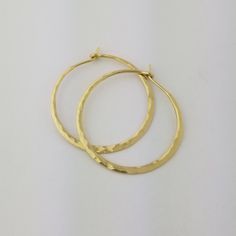 "Gorgeous Hammered Solid 18k Hoops made from 16 gauge (1.3mm) wire. 1.25\" Size photographed; 2\" size in 14k yellow gold shown in video METAL: Solid 18k Yellow Gold WIRE GAUGE/DIAMETER: 16 gauge (1.3mm) wire - Currently the thickest wire I offer EAR WIRE THICKNESS: Due to the thickness of the wire, the ear wire portion of the hoops will be tapered to approximately 18g, which is slightly thicker than standard ear wire thickness HAMMERED EFFECT: Each earring is made as a mirrored pair and the tex Saint Helens, Wire Gauge, Christmas Gifts For Wife, Earrings Christmas, Gold Wire, Gift For Wife, Metal Earrings, Ear Wire, Gifts For Wife