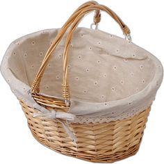 a wicker basket with white polka dots on the lining and handle is shown in front of a white background