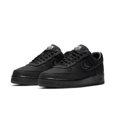 The Nike Stussy x Air Force 1 Low 'Triple Black' is a sleek and stylish sneaker that's perfect for everyday wear. With its breathable hemp construction, this sneaker is comfortable and easy to wear, while the split-embroidered Swoosh and Stussy's double S logo add a touch of style. The interlocking letters on the heel tab and tongue tag are also a nice touch, while the World Tour iconography on the tongue tag is a nice finishing touch. Nike High-top Sneakers With Textured Sole For Streetwear, Carbon Color Lace-up Sneakers With Boost Midsole, Nike Sporty Custom Sneakers With Textured Sole, Nike Custom Sneakers With Textured Sole, Nike Custom Sneakers With Textured Sole In Sporty Style, Nike Custom Sneakers With Textured Sole, Sporty Style, Modern Nike Air Force 1 Lace-up With Branded Insole, Nike Sneakers With Textured Sole For Light Sports, Nike Sporty Sneakers With Textured Sole