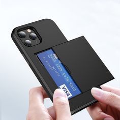 a person holding an iphone case with a credit card slot