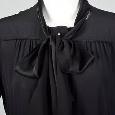 "This listing is for one dress. The textile is 100% silk in black and is lightweight. This dress has long sleeves, a button front, and two front pockets. There are fabric ties at the neck and waist that can be tied several different ways. The pockets are trimmed in raw-edged silk and this gives a very nice effect. An elegant choice for everyday wear! Please note that there is no label in this piece, it was purchased at a Bottega Veneta Sample sale in the 1990s. Size Marked: 40 Approximate Size: Black Silk Dress With Bow, Black Silk Dress Long, Silk Dress Long Sleeve, Black Silk Dress, Silk Dress Long, Long Sleeve Shift Dress, Fabric Belt, Dress Long Sleeve, Sample Sale