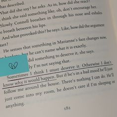 an open book with the page highlighted in red and blue, which has a heart on it