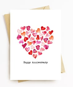 a card that says happy anniversary with lots of hearts in the shape of a heart