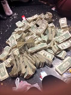 a pile of money sitting on top of a table