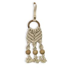 a keychain with wooden beads and tassels on the end, hanging from a