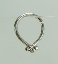 Tribal Sterling Silver septum - A beautiful unique septum Indian Tribal style nose jewelry that's shine on. ~ Can be used as a nose ring /septum / tragus / single earring / helix / lip ring ~ Size of the nose ring: Inner diameter : 5/16 or 3/8 inch (8 or 9 mm) Wire gauge : 20,18 or 16 ( 0.8, 1 or 1.2 mm) ~ For larger sizes and special requests please contact me through the' Request custom order' bar. ~To open the ring -gently twist the ends sideways, slip into the hole and then gently twist the Elegant Silver Hypoallergenic Septum Ring, Elegant Silver Small Hoop Septum Ring, Elegant Silver Septum Ring, Sterling Silver Small Hoop Septum Ring, Elegant Small Hoop Nickel-free Nose Rings, Elegant Small Hoop Nose Rings Nickel Free, Elegant Nickel-free Small Hoop Nose Rings, Elegant Nickel-free Hoop Nose Ring, Elegant Small Hoop Silver Nose Rings