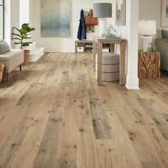 a living room with wood floors and white walls