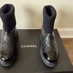 Nib Chanel Leather Ankle Sock Boot With Patent Leather Toe Cap With Cc Logo And Quilted Leather Detail. Size 38- Best For A 37 - They Run Small. Purchased From A Chanel Boutique. Chanel Ankle Boots 2022, Boots Chanel, Sock Boot, Chanel Boots, Chanel Boutique, Ankle Sock, Leather Detail, Cc Logo, Chanel Shoes