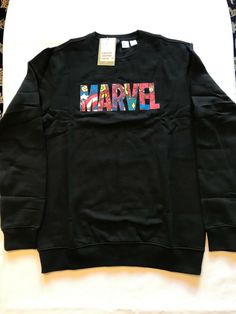 a black sweatshirt with the word marvel printed on it