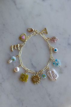 Charm Bracelet Pink, Charm Ideas, Sun Charm, Necklace Diy, Jewelry Essentials