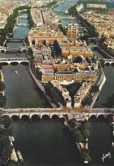 an aerial view of a city with bridges and buildings