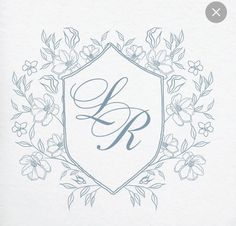 the initial letter b is surrounded by flowers and leaves on a white paper with blue ink