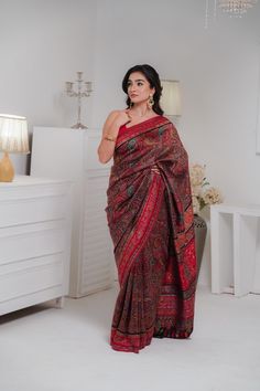 Black Kani Saree in silk fabric showcases an array of paisleys over the body in Kani Jamawar weaving. Beautiful color combinations and a touch of zari thread add to the beauty of this saree. The look is complete with a blouse piece that has Kani weaving in scattered booti pattern. The design inspiration for this Pashmina Silk saree is drawn from the heritage weaves of ancient Pashmina shawls from our history that dates back to the Mughal era.  Kani is an ancient and traditional craft of Kashmir Elegant Silk Pashmina Shawl With Zari Work, Elegant Silk Pashmina Shawl For Festivals, Multicolor Pashmina Saree In Traditional Drape, Elegant Unstitched Pashmina Traditional Wear, Elegant Pre-draped Jamawar Saree With Zari Weaving, Elegant Pre-draped Jamawar Saree With Pallu, Elegant Festive Pashmina Saree, Elegant Katan Silk Pashmina Shawl With Traditional Drape, Bohemian Banarasi Silk Saree With Self Design