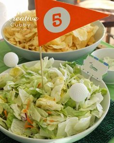 a salad and chips on a table at a golf themed birthday party