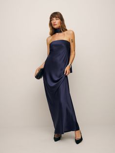 Don't flirt with me. Shop the Oren Silk Dress from Reformation,  a strapless midi dress with a straight neckline, an A-line silhouette, and matching scarf. One Shoulder Party Dress, Earthy Wedding Guest Dress, Dark Blue Silk Bridesmaid Dresses, Neutral Formal Dress, Pre-draped Silk Slip Dress For Gala, Navy Strapless Dress, Formal Dress With Scarf, Silk Slip Dress With Straight Neckline For Night Out, Slip Dress With Satin Finish And Straight Neckline