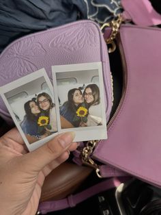 two polaroid photos being held up in front of a purse