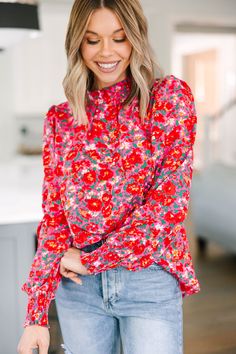 We can't change this blouse nor would we want to! It's gorgeous! That floral print is so vibrant and feminine! This blouse also has a very classic fit that we can't get over! You are going to love wearing this beauty for a day at work or for grabbing lunch with a friend! This blouse features a round neckline, long sleeves, and a floral print. Material has no amount of stretch.Cam is wearing the small. Feminine Long Sleeve Blouse With Ditsy Floral Print, Feminine Ditsy Floral Long Sleeve Top, Red Tops With Vibrant Print For Fall, Feminine Long Sleeve Tops With Ditsy Floral Print, Feminine Long Sleeve Ditsy Floral Print Top, Feminine Long Sleeve Ditsy Floral Top, Red Blouse With Vibrant Print For Fall, Fall Floral Print Red Top, Fall Red Floral Print Tops