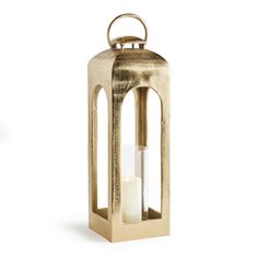 a gold metal lantern with two candles inside