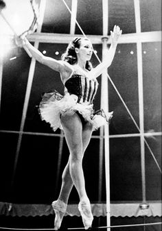 a black and white photo of a ballerina