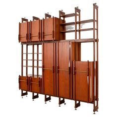 an art deco bookcase with sliding doors and drawers in the shape of bookshelves