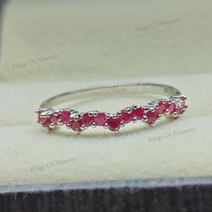 Natural Ruby Ring, Vintage Ruby Band, Ruby Wedding Band, Dainty Ruby Ring, Sterling Silver Ring, July Birthstone Ring, Matching Band Ring -------------------------------------------------------------------------------------------------------------------------------------------------------------------------------------------------------------- Ruby Wedding Band * Metal : 925 Sterling Silver  * Gemstone  Stone : Ruby * Shape  : Round  * Size : 1.8mm * Weight : 1.86 Ct ( Approx. )   * Clarity : Eye Clean * Personalization : Possible * Occasion : Party , Anniversary , Wedding Sent in a very elegant wedding ring box, ready for one special lady. Customization is always welcome and please feel free to contact with me if you have any design ideas! Thank You....:) Adjustable Ruby Promise Ring, Adjustable Ruby Wedding Ring, Adjustable Ruby Rings For Wedding, Adjustable Ruby Ring With Birthstone For Wedding, Adjustable Ruby Birthstone Ring For Wedding, White Gold Ruby Ring With Half Eternity For Promise, White Gold Ruby Half Eternity Promise Ring, Elegant Adjustable Ruby Wedding Ring, Silver Ruby Half Eternity Ring