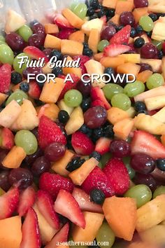 fruit salad for a crowd with grapes, strawberries, apples and blueberries