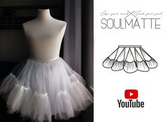 a white tulle skirt on a mannequin with the words you tube below it