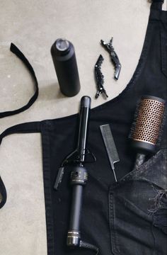 a black apron with an old microphone and other accessories