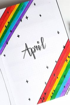 an open notebook with the word april written in cursive writing on top of it