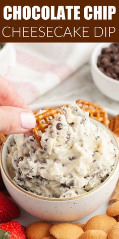 chocolate chip cheesecake dip in a white bowl surrounded by crackers and pretzels