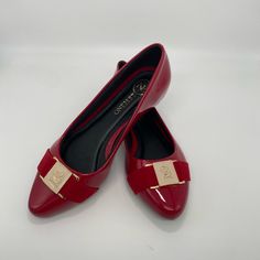 Patent Vegan Leather Ballerina.. Golden Buckle. Slight Heel, Slip On. Black Lining And Sole Are Synthetic Made In Ecuador Red Low Heel Flats For Evening, Elegant Evening Flats With Red Sole, Elegant Red Low Heel Flats, Red Pointed Toe Flats For Party, Red Pointed Toe Flats For Evening, Elegant Flats With Red Sole, Elegant Red Slip-on Flats, Elegant Red Flats For Formal Occasions, Red Round Toe Flats For Evening