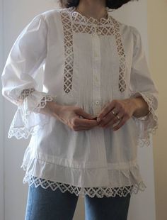 Antique 20s hand embroidered cotton blouse. Wonderful embroidery, entirely handmade. Please look at this back!😍 Mother of pearl buttons. Balloon sleeves, gorgeous cuffs Beautiful cotton. A piece of art in perfect condition. Best fit size S and XS Shoulder to shoulder 36 cm Bust 47 cm (x2) Front length 68 cm Back length 59 cm Model's size 8 UK h 163 cm. Bohemian Broderie Anglaise Blouse For Daywear, White Cotton Blouse With Lace Cuffs, Cotton Blouse With Lace Cuffs, Victorian Long Sleeve Cotton Blouse, Cotton Tops With Lace Trim For Weddings, Victorian Style White Cotton Top, Victorian White Cotton Top, Vintage Cotton Bishop Sleeve Top, Vintage Cotton Tops With Bishop Sleeves